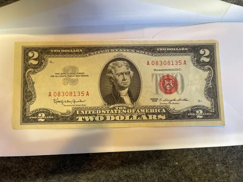 Series 1963 2 Dollar Bill Red Seal Crisp Uncirculated from auction in Brewton, Alabama