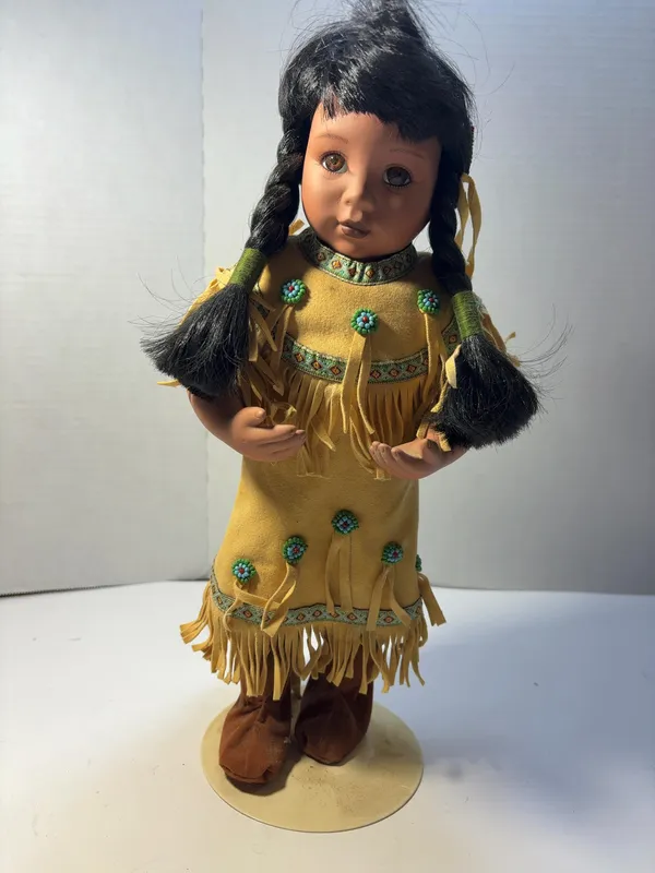 Native American Style Bisque Porcelain Collector Doll in Fringed Yellow Dress from auction in Brewton, Alabama