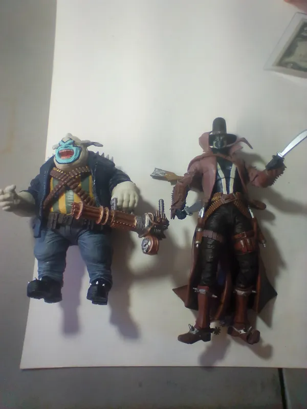 A Pair of TMP Intl. LLC Articulated. Two Spawn Action Figures and a Heavy Weapon Robotic Accessory McFarlane Toys from auction in Brewton, Alabama