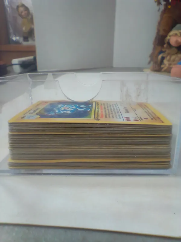 A Collection of Early Edition Pokémon Trading Cards Including 1st Edition Machamp Holographic Base Set 8/102 from auction in Brewton, Alabama