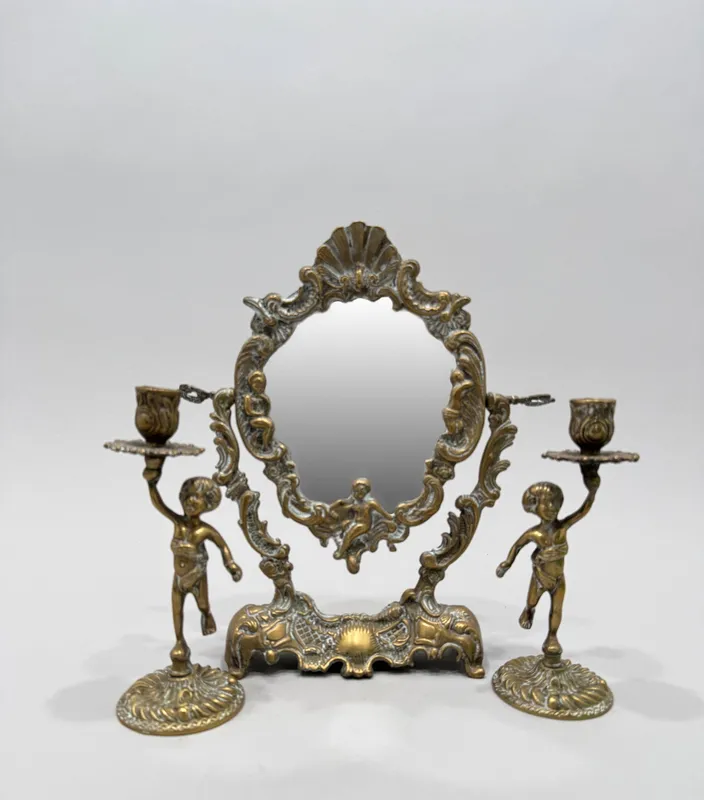 Brass Mirror and Cherub Candlesticks from auction in Cranston, Rhode Island