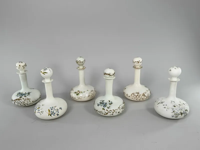 Group of Six Hand-painted Milk Glass Decanters from auction in Cranston, Rhode Island