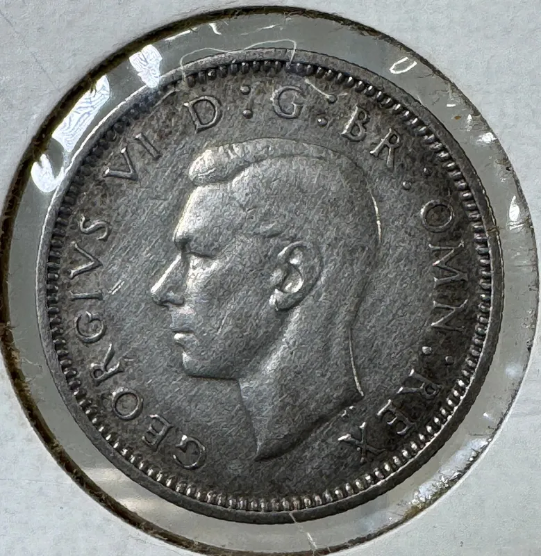 1945 British Sixpence Coin - 500 Silver from auction in Cranston, Rhode Island