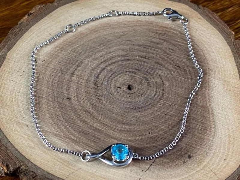 Sterling Silver Topaz Bracelet from auction in Orlando, Florida