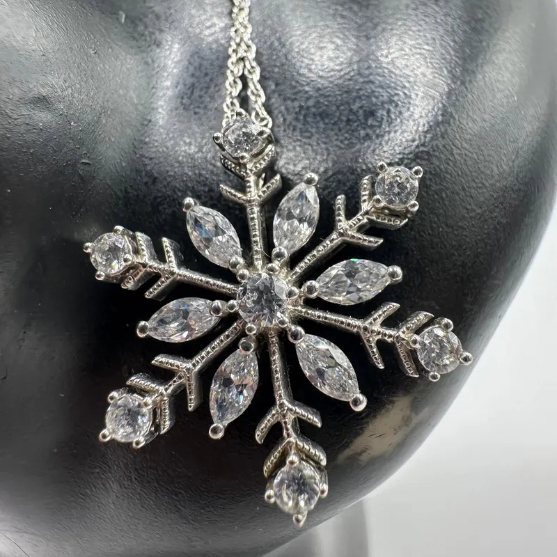 Sterling Silver Snowflake Pendant Round Cut Cubic Zirconia Accents from auction in Orlando, Florida