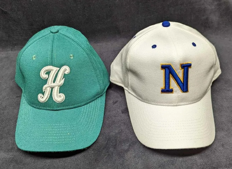 2 Rangers & Huskies Baseball Caps from auction in Orlando, Florida
