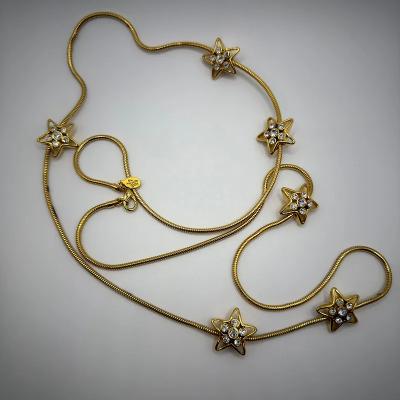 Nolan Miller Crystal Rhinestone Star Snake Chain Necklace Long from auction in Orlando, Florida