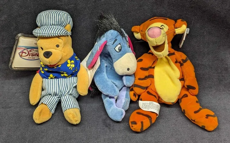 3 Disney Winnie The Pooh Bean Bag Dolls from auction in Orlando, Florida