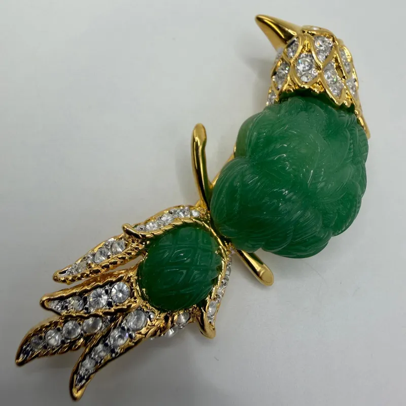 Nolan Miller Glamour Collection Faux Jade and Rhinestone Bird of Paradise Pin from auction in Orlando, Florida