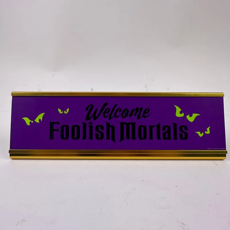 Foolish Mortals Haunted Mansion Desk Decor Disney Table Plaque from auction in Orlando, Florida