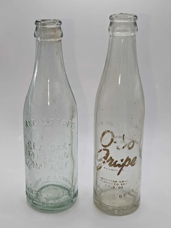 2 Vintage O-So Grape Red Oak Bottling Company  Glass Bottles from auction in Orlando, Florida