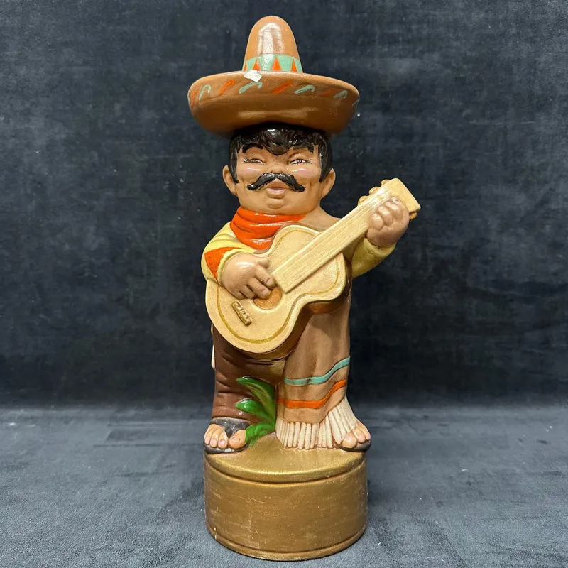 Hand Painted Ceramic Mariachi Musician Figurine with Guitar and Sombrero from auction in Orlando, Florida