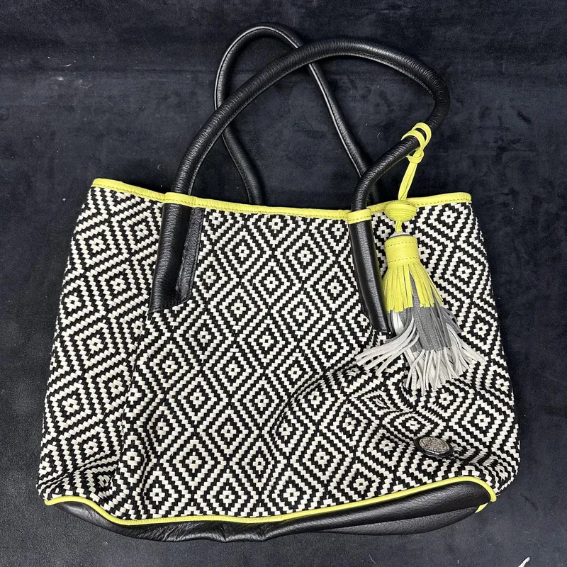 Vince Camuto Woven Tote Handbag Black and White with Light Green Trim from auction in Orlando, Florida