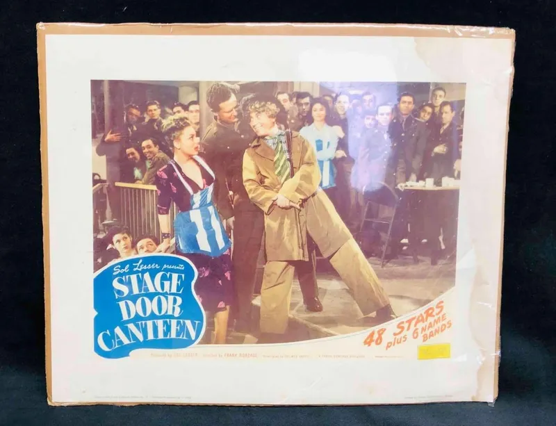Three Lobby Cards Stage Door Canteen 1984 & Two Disney The TenderFoot 1964 from auction in Orlando, Florida