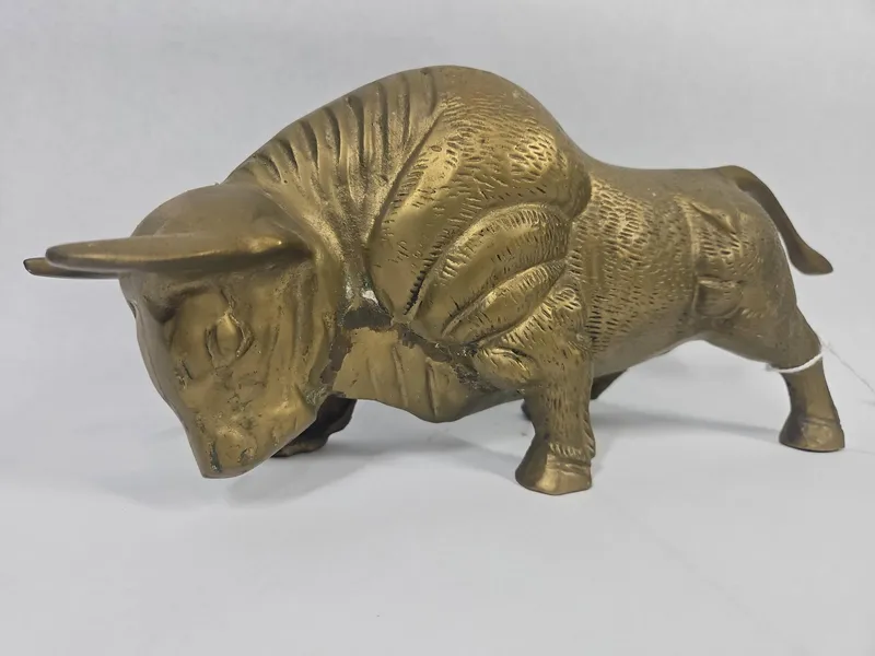 Mid-C. Modern Cast Brass Charging Bull from auction in Dundee, Ohio
