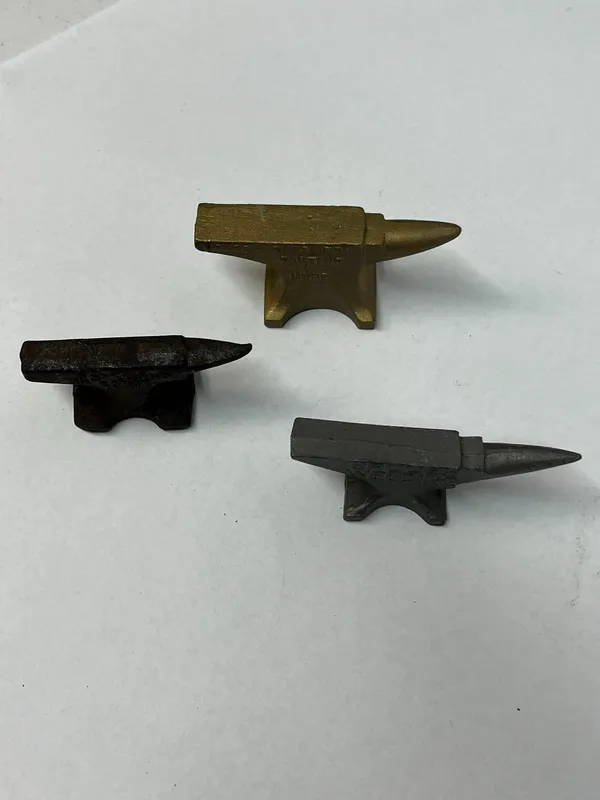 Trio Promotional Cast Metal Anvils from auction in Dundee, Ohio