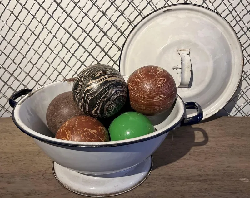 Marbled Carpet Balls & Enamel Bowl from auction in Dundee, Ohio