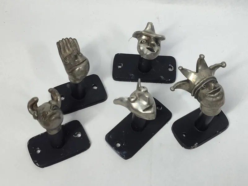 Set 5 Figural Metal Wall Hooks from auction in Dundee, Ohio