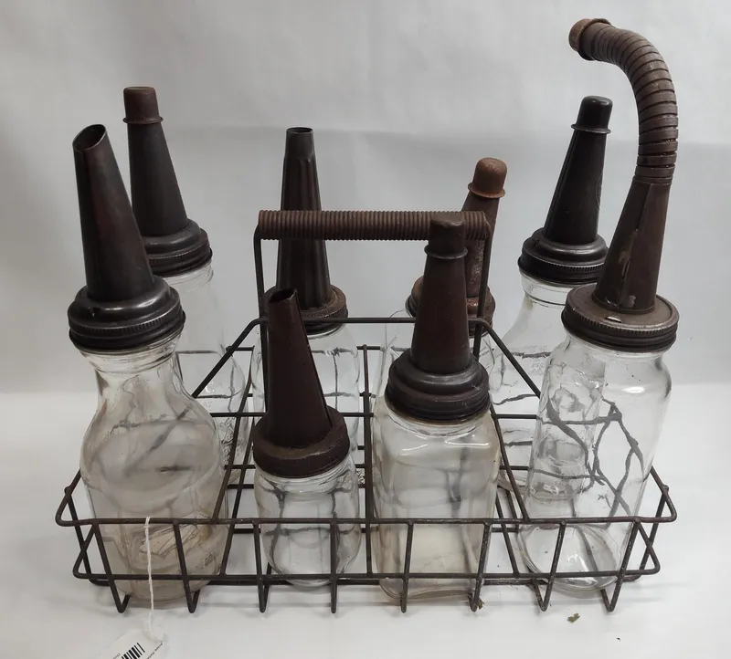 Glass Oil Bottles & Spouts in Rack from auction in Dundee, Ohio