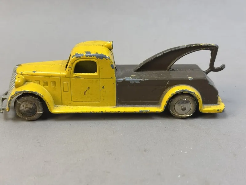 Tootsie Toy Yellow Brown 5.5" Wrecker Toy Truck from auction in Jackson, Michigan