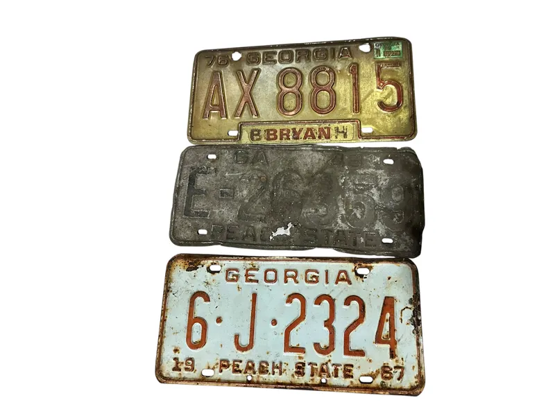 3 Vintage Georgia License Plates from auction in Cleveland, Georgia