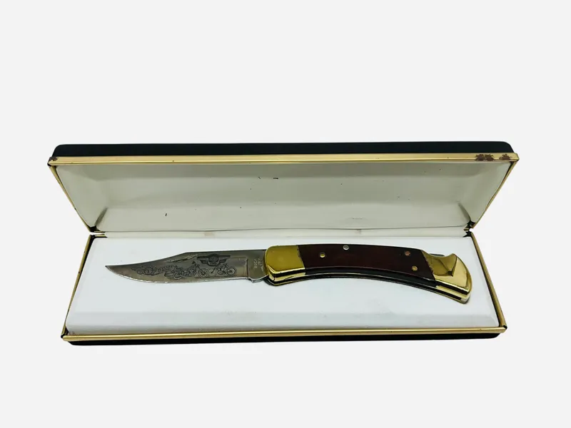 Buck 110U Harley Davidson Pocket Knife from auction in Cleveland, Georgia