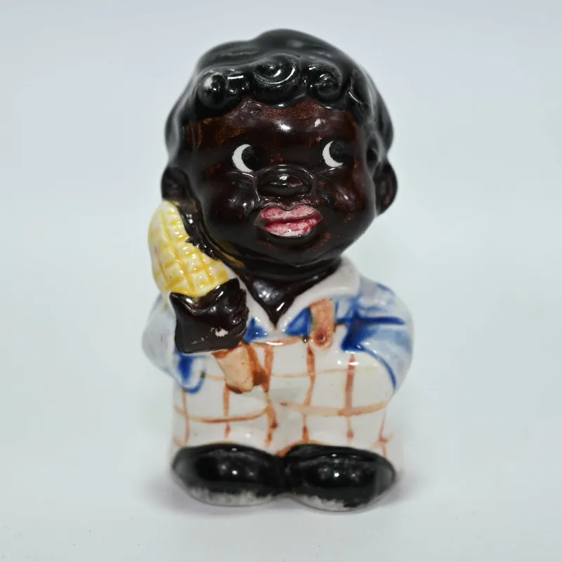 Pepper Shaker - Man with an Ear of Corn - - Black Americana from auction in Winnetka, Illinois