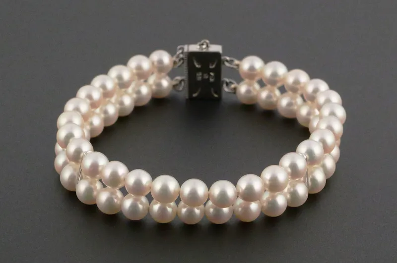 MIKIMOTO 14k Gold Dbl-Strand Pearl Bracelet from auction in Clearwater, Florida