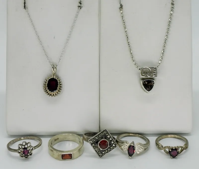 Seven Sterling Garnet Rings & Necklaces from auction in Ottawa, Ohio