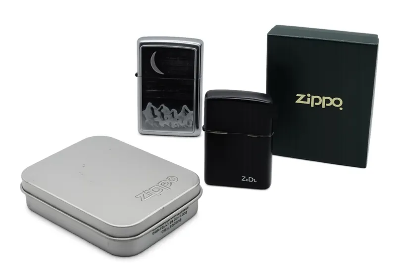 2001 Zippo Moon Mountain & 1997 Black Logo Lighter from auction in Ottawa, Ohio