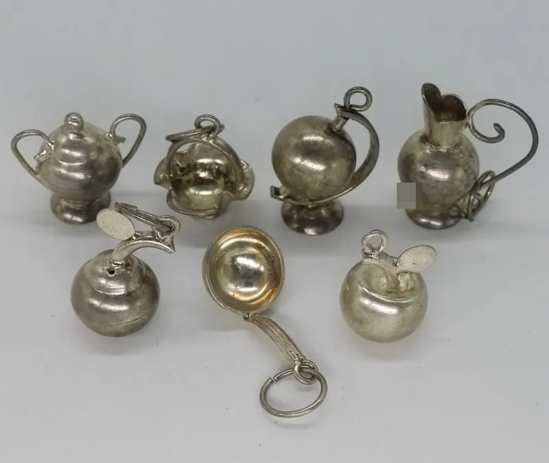 7 Sterling Silver Miniature Tea Set Charms from auction in Ottawa, Ohio