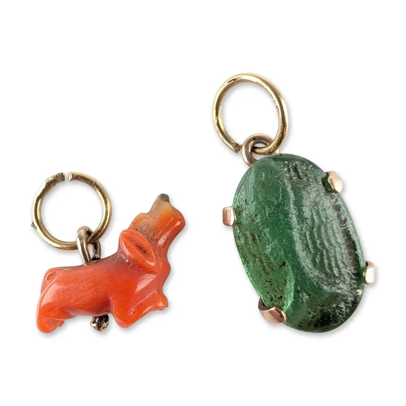 Two 14K Yellow Gold, Coral and Glass Animal Pendants from auction in Hollywood, Florida