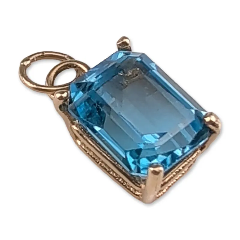 14K Yellow Gold Emerald Cut Blue Topaz Pendant Charm from auction in Hollywood, Florida