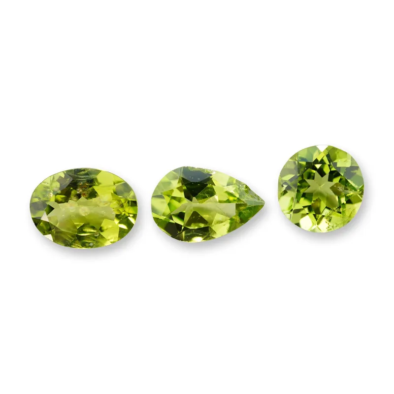 3pc Oval, Round and Pear Shape Peridot Gemstones from auction in Hollywood, Florida