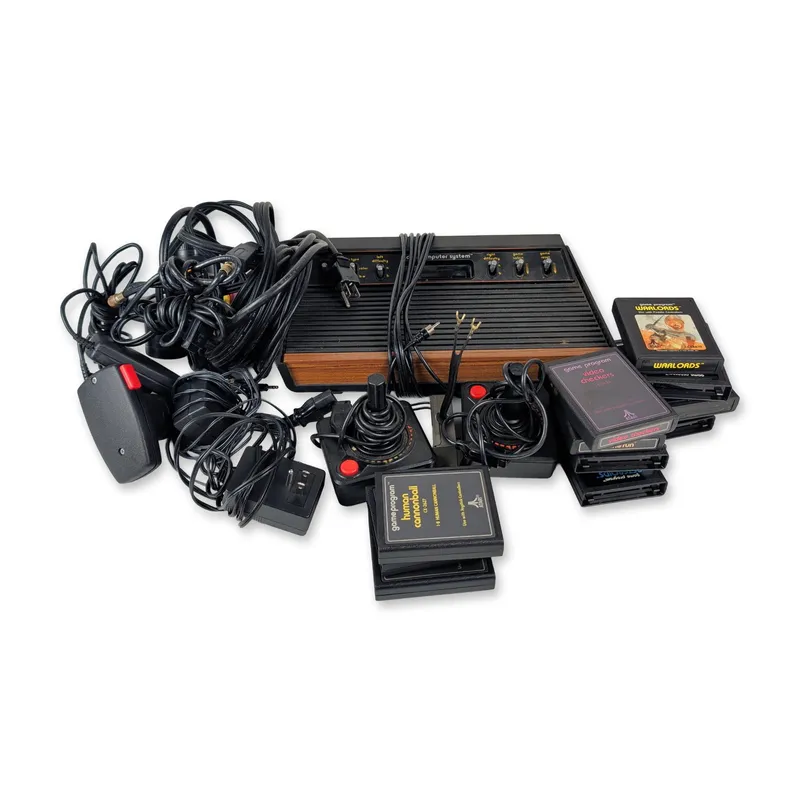 Atari 2600 Video Computer System Woodgrain Console and Game Bundle from auction in Hollywood, Florida