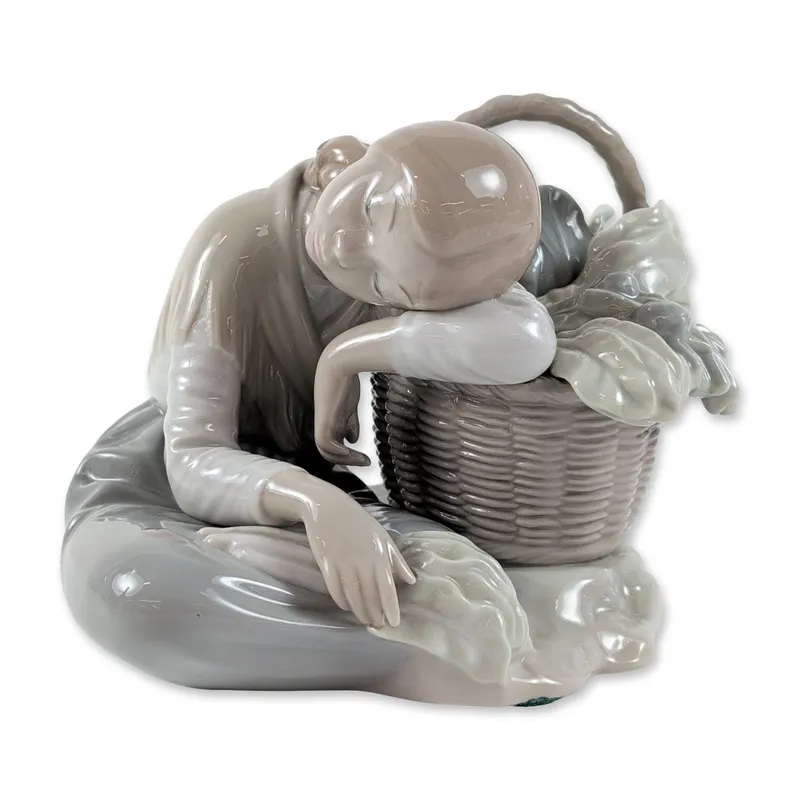 Lladro Spanish Glazed Porcelain Cabbage Seller Figurine from auction in Hollywood, Florida
