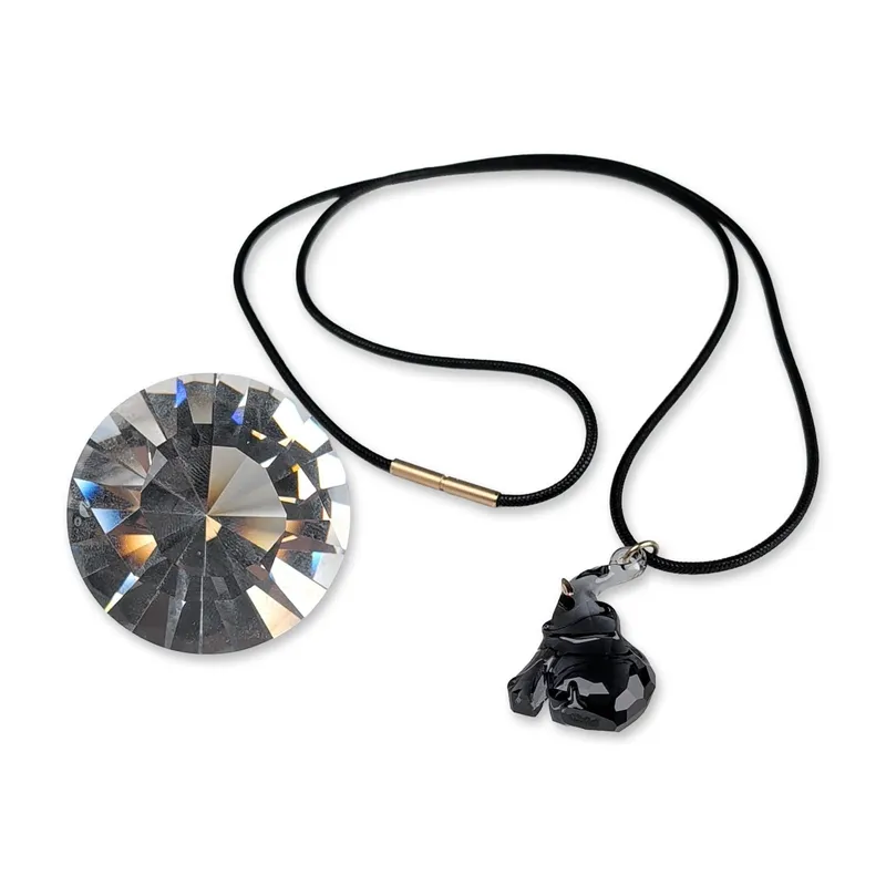 Two Swarovski Crystal Society Elephant Necklace and Chaton Facet from auction in Hollywood, Florida