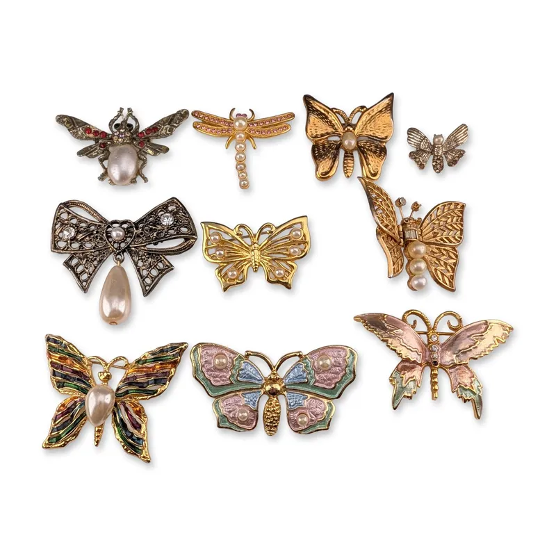 10pc Collection of Vintage Style Insect and Bow Brooches from auction in Hollywood, Florida