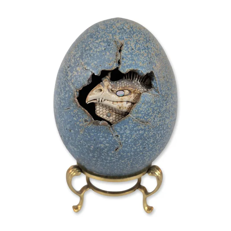 Dennis Thompson Ceramic Hatching Dragon Egg Sculpture on Brass Stand from auction in Hollywood, Florida