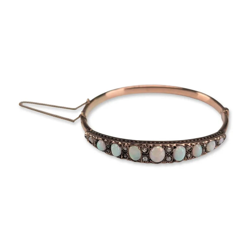 Antique Victorian 10K Rose Gold Opal and Diamond Bangle Bracelet from auction in Hollywood, Florida