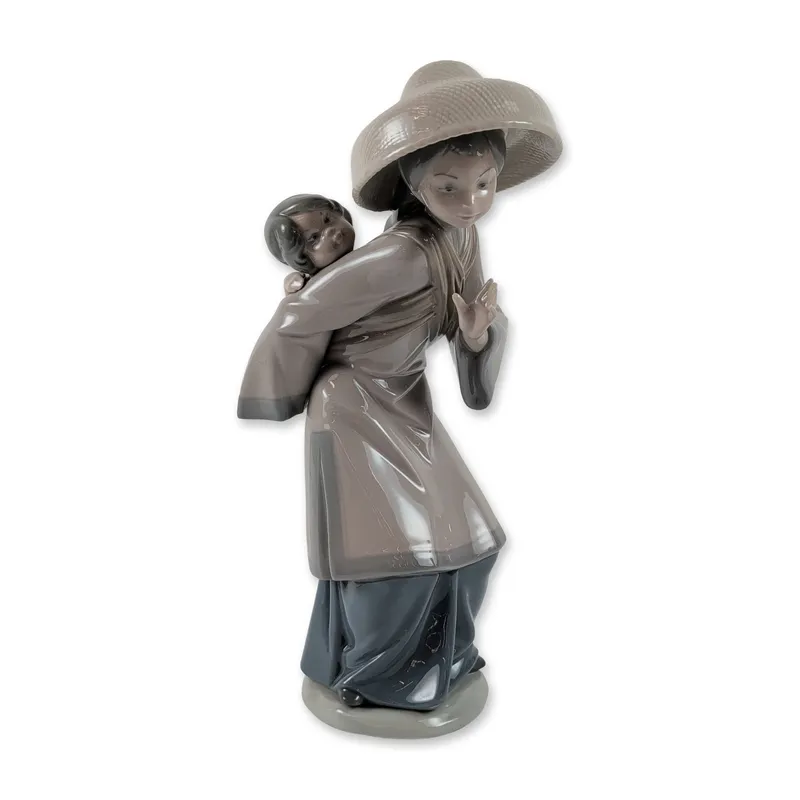 Lladro Porcelain Figurine, My Precious Bundle 1005123 from auction in Hollywood, Florida