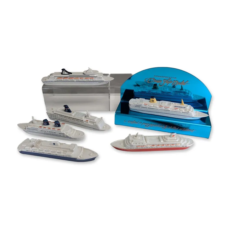 7pc Passport Products Porcelain Cruise Ship Commemorative Models with Display Stand from auction in Hollywood, Florida