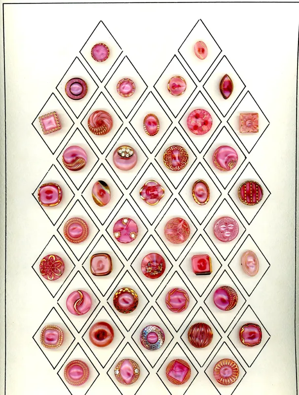 A CARD OF 1940'S WEST GERMAN GLASS MOONGLOW BUTTONS from auction in Hollywood, Florida
