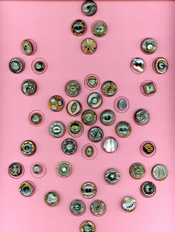 A CARD OF DIVISION THREE MOONGLOW GLASS BUTTONS from auction in Hollywood, Florida