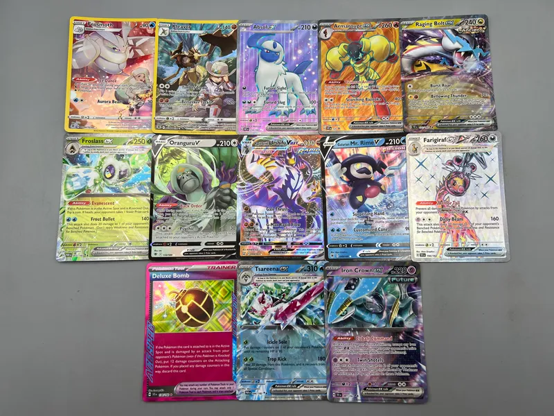 Lot of (13) Assorted Pokemon EX & Full Art Trading Cards - Includes ETB Sleeves from auction in Greenville, Ohio