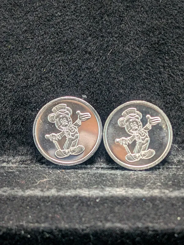 (2) Mickey Mouse .999 Fine Silver Rounds - 1.6 grams Each, 3.2 grams Total Of .999 Fine Silver from auction in Greenville, Ohio