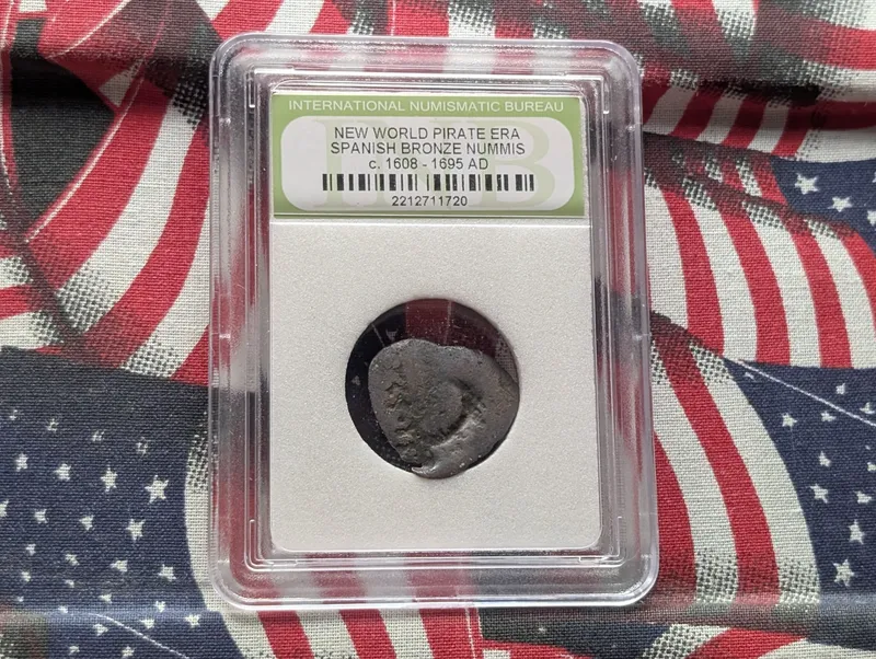 c. 1608-1695 AD New World Pirate Era Spanish Bronze Nummis Coin - Slabbed International Numismatic Bureau from auction in Greenville, Ohio