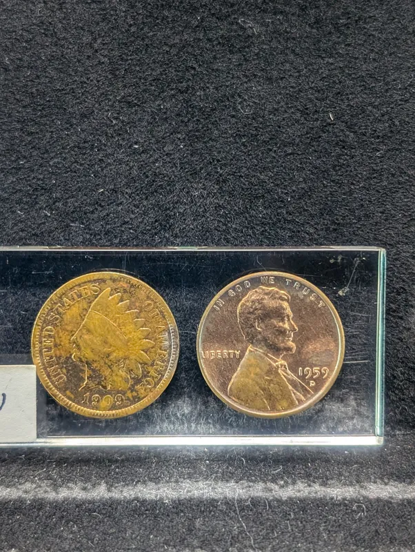 1909 Indian Head Cent and 1959-D Lincoln Memorial Cent in Acrylic Key Chain Holder. from auction in Greenville, Ohio