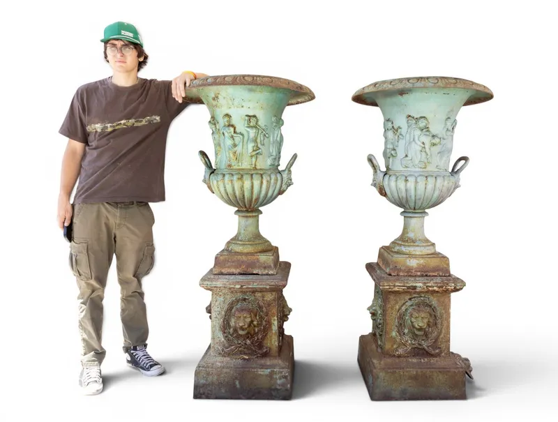 Pair Neoclassical Cast Iron Lion Head Urns ~5' H from auction in York, Pennsylvania