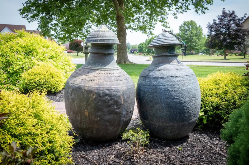 Monumental Nepalese Metal Water Jars, Pair from auction in York, Pennsylvania